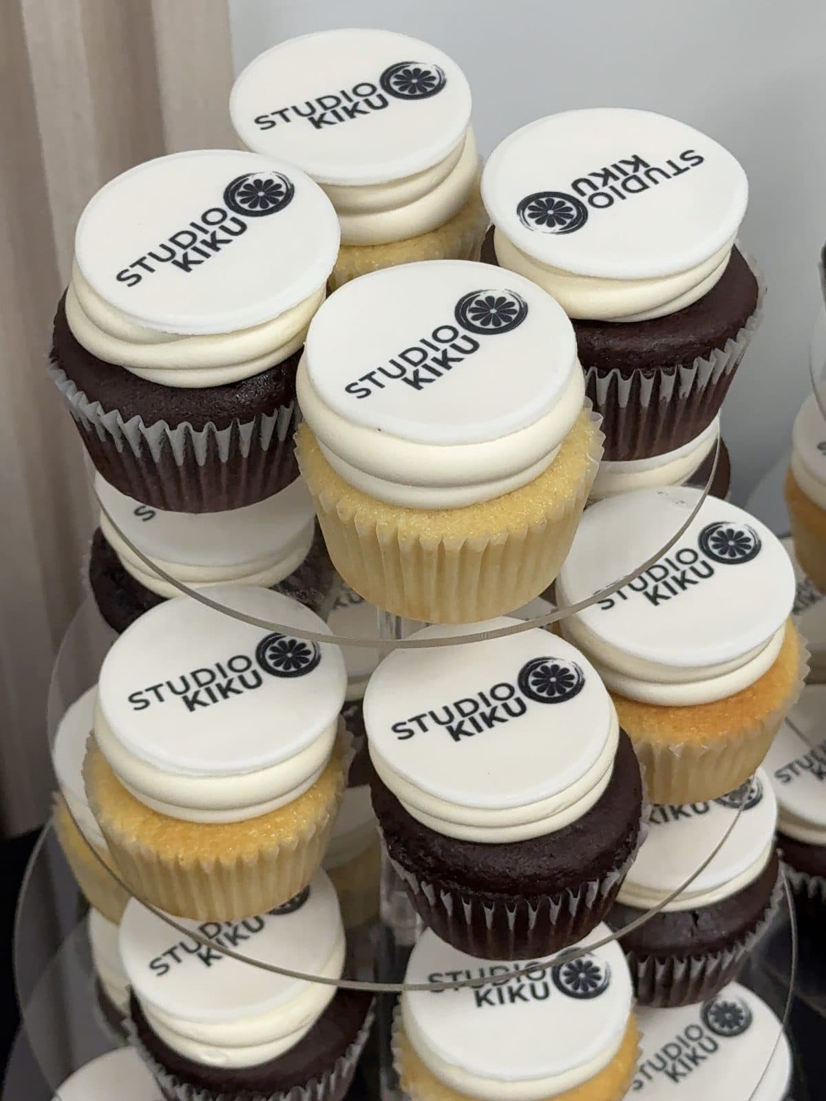 Cupcakes topped with the Studio Kiku logo