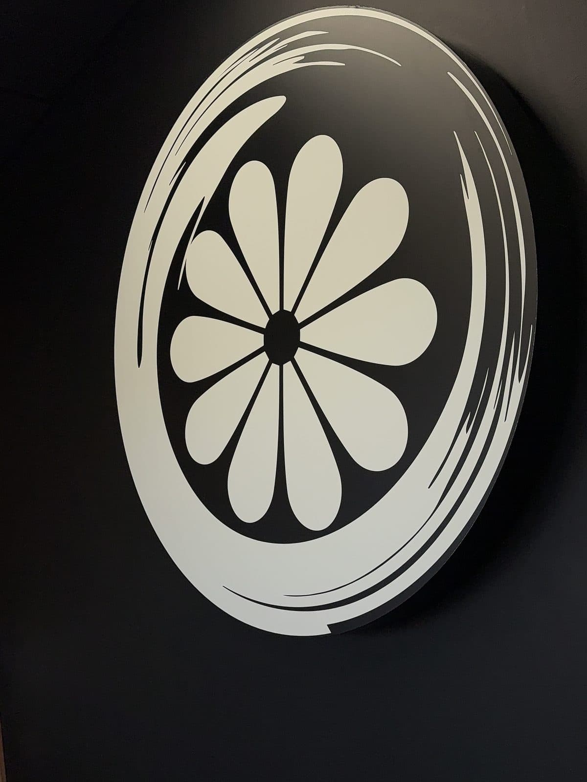 The Studio Kiku logo on the black wall inside the Vaughan studio